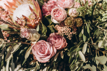 Wedding asymmetrical stylish bouquet with purple roses