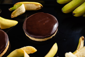 tasty banana cake on the black background