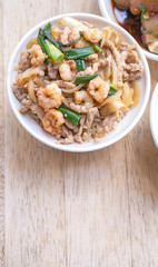 Braised shrimp over rice - Taiwan famous traditional street food. Soy-stewed prawn on cooked rice. Travel concept, top view, copy space, close up
