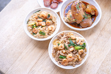 Braised shrimp over rice - Taiwan famous traditional street food. Soy-stewed prawn on cooked rice. Travel concept, top view, copy space, close up