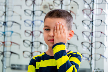 Little boy having eye test at ophthalmologist office