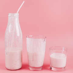 Fruit milkshake on pink background