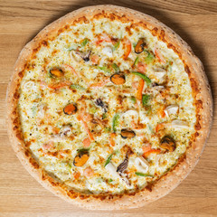 italian pizza on the wooden background