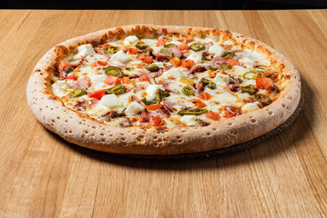 pizza on the wooden background