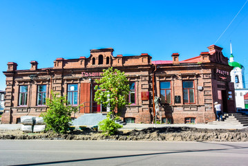 lesosibirsk / Russia - june 06 2019: old wooden houses with carved Windows. Small town. Village