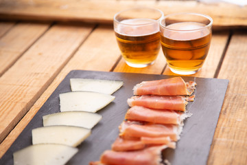 beer and cheese and serrano ham board from spain