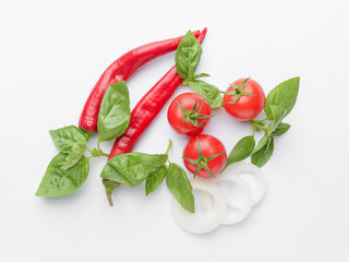 Fresh vegetables and spices on white background