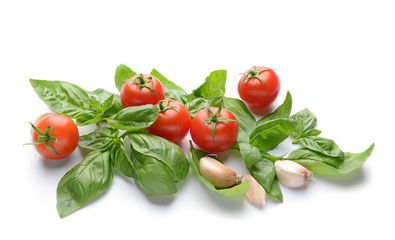 Fresh vegetables and spices on white background