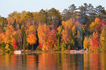 bond fire on shores of autumn fall colors 