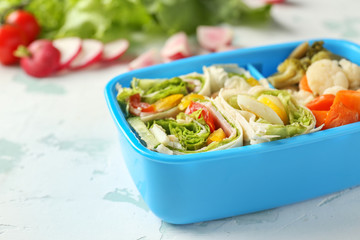 School lunch box with tasty food on table