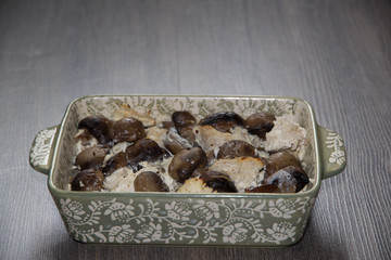 Chicken stewed in the oven with mushrooms