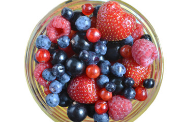 berries raspberries currants strawberries in Cup on white background isolate
