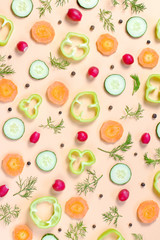 Salad ingredients layout. Food pattern with cherry tomatoes, carrot, cucumbers, radish, greens, pepper and spices