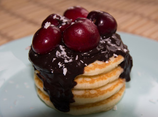 Pancake with chocolate cream and cherry