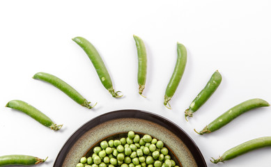 Closeup of green fresh peas and pea pods. Healthy food.