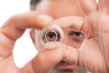 Fototapeta premium Closeup of man holding rings