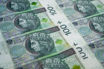 Obraz na płótnie Canvas Polish zloty banknotes. One hundred zloty banknotes from top