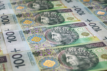 Fototapeta na wymiar Polish currency background. One hundred zloty banknotes. Closeup
