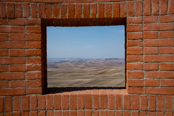 Agricultural landscape of Murgia plateau viewed from a window. Poggiorsini village. Apulia region, Italy