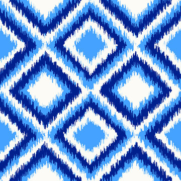 Uzbek ikat silk fabric pattern, indigo blue and white colors.