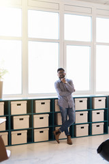 Young man asian smiling and looking at camera. Portrait of a happy handsome young man in office. Close up face of young cool trendy man looking at camera