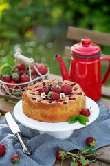cake with fresh strawberry on wooden table, outdoor