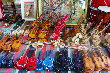 Wooden handmade souvenirs. string musical instruments at souvenir shop in Azerbaijan