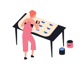 Funny girl printing pattern on fabric using woodblocks and paint isolated on white background