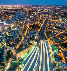 London night aerial view. Railway station, Thames river and city skyline