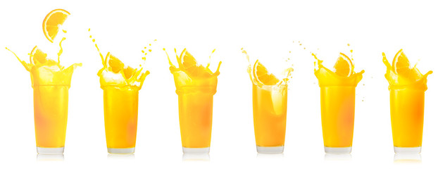 Glass of orange juice with splash from falling orange slice