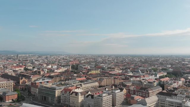 Panorama aerial footage shows the Pest city side, buildings, roof and New Budapest Gallery and the traffic in Budapest with River Danube, Hungary | Stock video 60fps 2.7