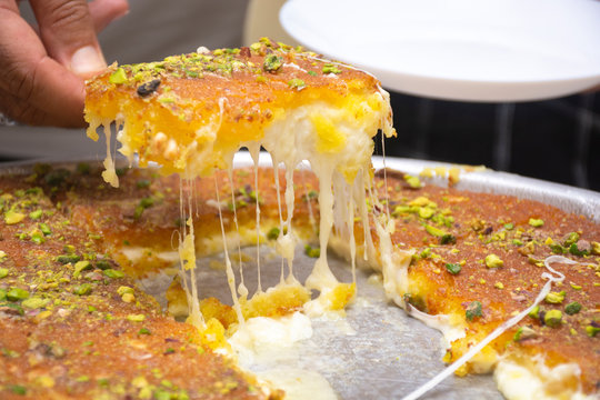 Arabic sweet "Konafa" or "Knafeh" with white cheese and pistachio