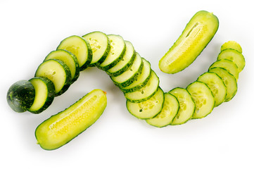 Fresh bright green cucumber slices on a white background
