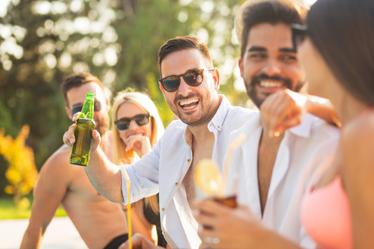 Friends at a poolside party - Powered by Adobe