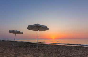 umbrella on the beach and sunrise