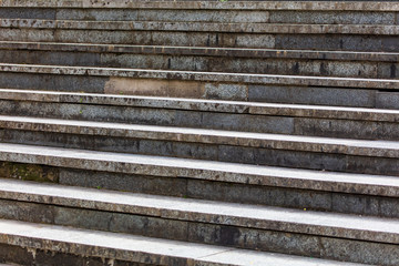 Old concrete steps on the stairs as background