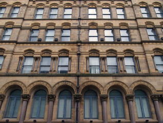 Fototapeta na wymiar the facade of the former milligan and forbes warehouse in bradford west yorkshire a large palazzo style building built by andrew and delauney in 1853