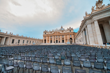 ROME, ITALY - JUNE 2014: Tourists visit St Peter Square in Vatican. The city attracts 15 million people annually