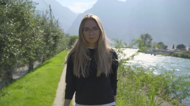 Teenage Girl Walking Along hte River