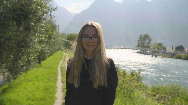Teenage Girl Walking Along hte River