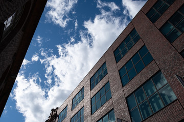 Worms eye view of clouds in blue sky