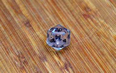 White rpg die on table. D&D - Dungeons and dragons. Role playing game. Fantasy and adventure.