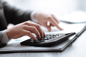 close up. businessman can use the calculator to calculate profit