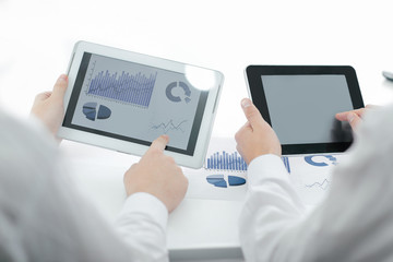 close up.businessman pointing with pen on a digital tablet screen.
