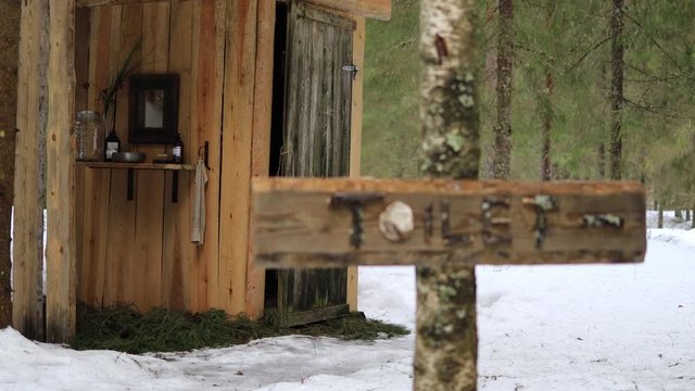 Secluded lodge with toilet is revealed to be located deep in the snow-covered forest