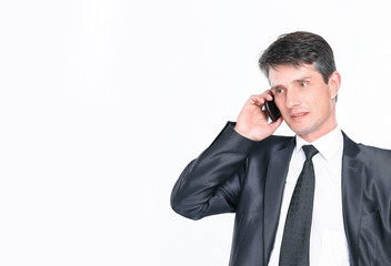 confident businessman talking on the phone.isolated on white