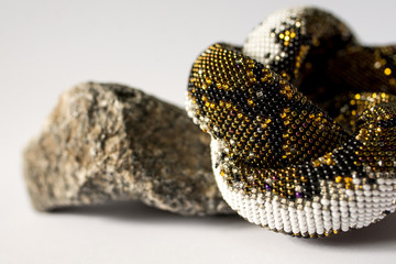 artificial snake on white background fashion
