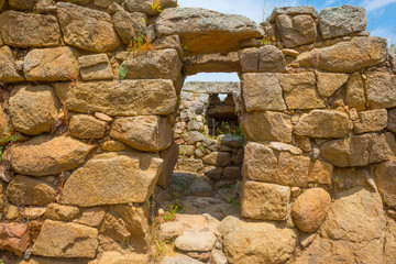 Nuraghe ruins in the landscape of Sardinia in sunlight in spring