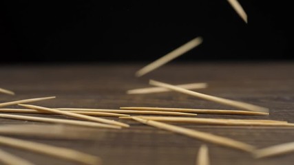A lot of toothpicks fall down. Slow motion - Powered by Adobe