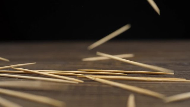 A lot of toothpicks fall down. Slow motion